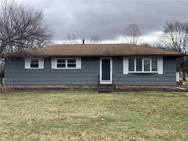 single story home with entry steps and a front lawn