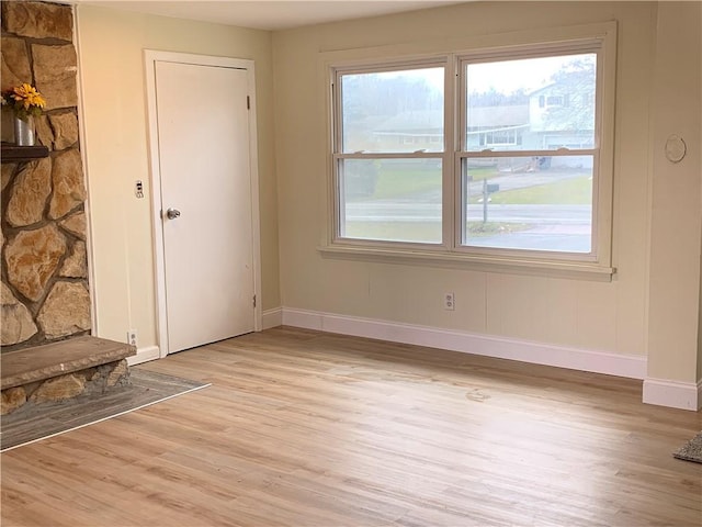 interior space with light wood-style floors and baseboards