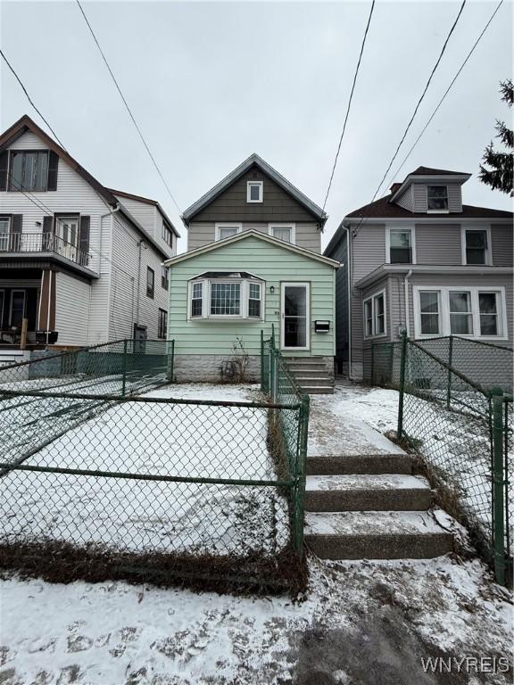 view of front of house with fence