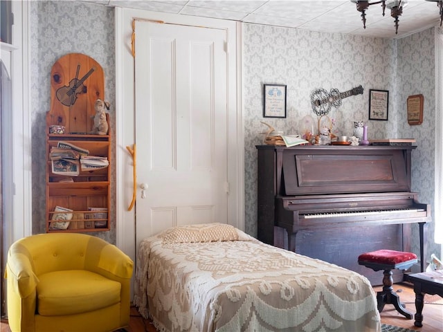 bedroom featuring wallpapered walls