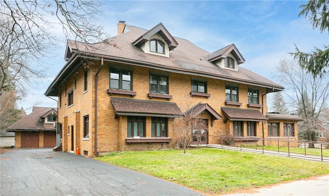 2956 Saint Paul Blvd, Irondequoit, NY 14617 - view of front of house with brick siding, a chimney, a front lawn, and fence
