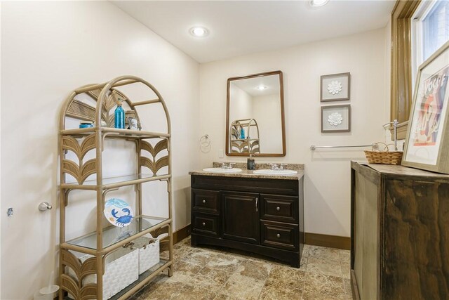 2956 Saint Paul Blvd, Irondequoit, NY 14617 - bathroom with recessed lighting, stone finish floor, vanity, and baseboards