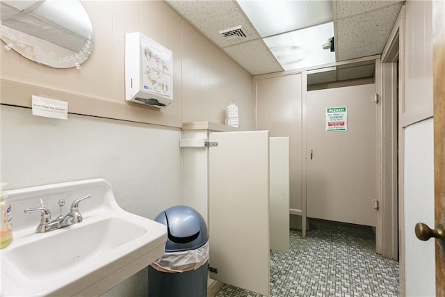 2956 Saint Paul Blvd, Irondequoit, NY 14617 - bathroom with visible vents, a drop ceiling, and a sink