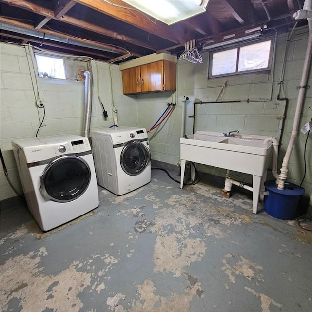 washroom featuring laundry area, plenty of natural light, and washer and clothes dryer