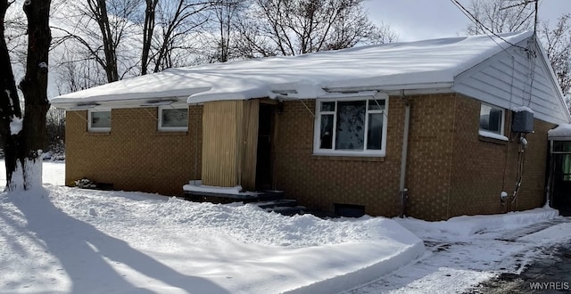 view of front of home featuring brick siding