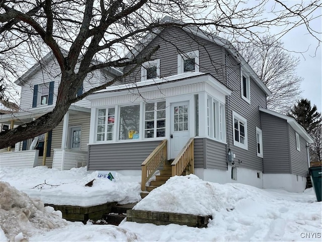 view of front facade with entry steps and a garage