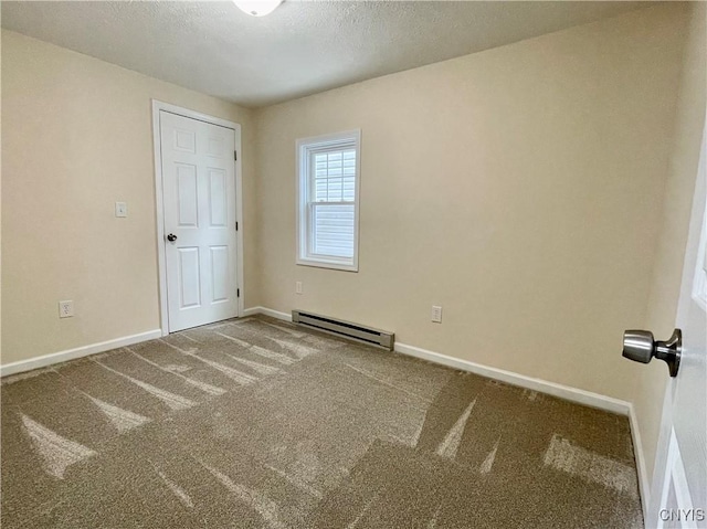 unfurnished room with carpet floors, a baseboard radiator, baseboards, and a textured ceiling