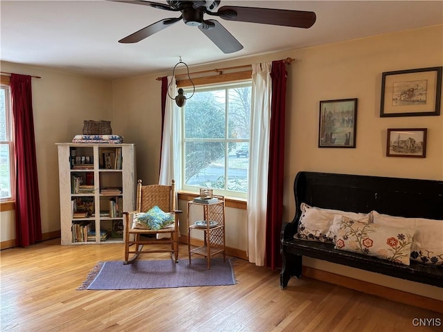 sitting room featuring light wood-style floors and baseboards