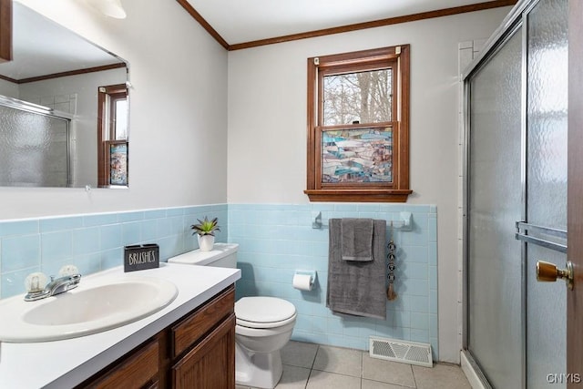 bathroom featuring a stall shower, tile patterned floors, visible vents, and a healthy amount of sunlight