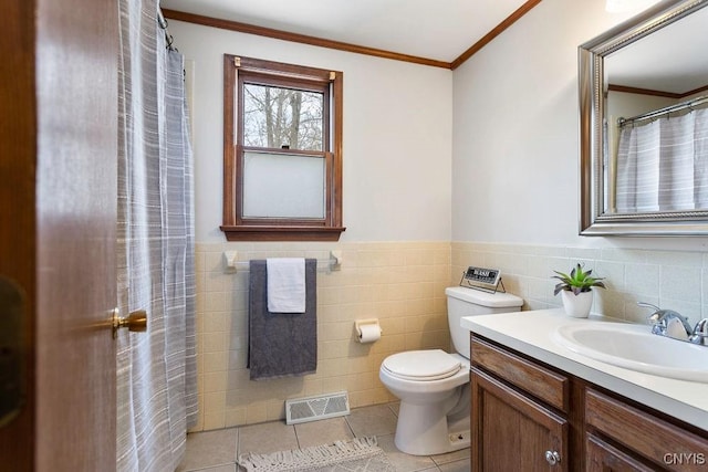 full bathroom with visible vents, toilet, ornamental molding, vanity, and tile patterned flooring