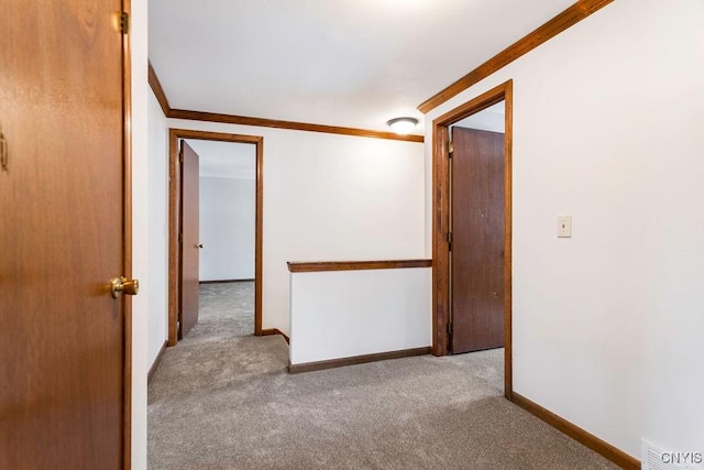 unfurnished room featuring carpet floors, baseboards, and ornamental molding