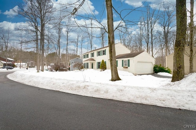 colonial home with a garage