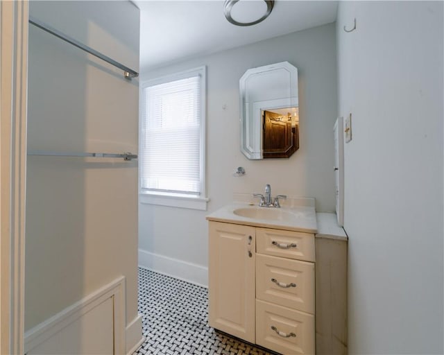 bathroom featuring vanity and baseboards