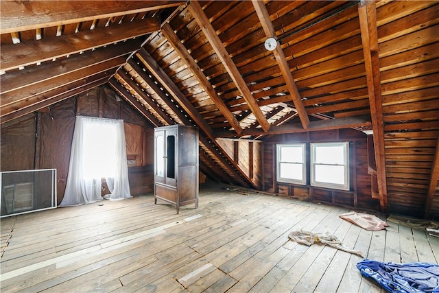 unfinished attic featuring a healthy amount of sunlight