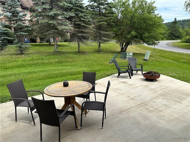 view of patio / terrace featuring a fire pit