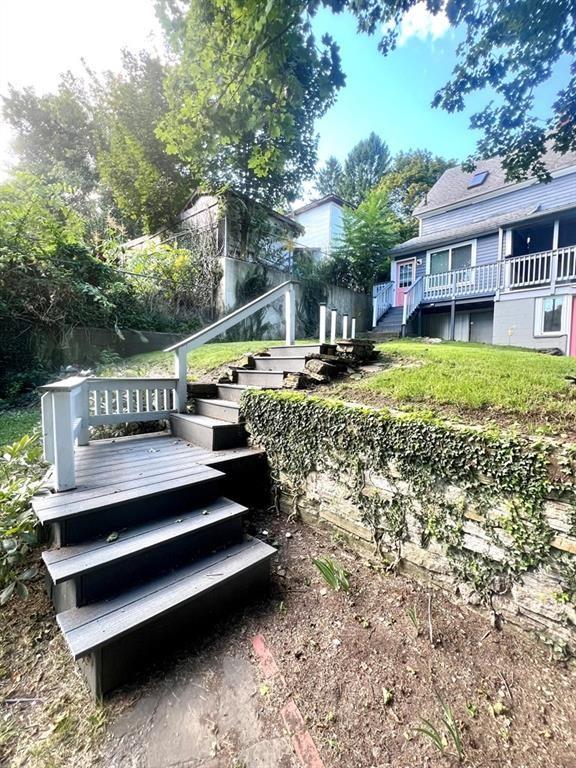 exterior space featuring a deck and stairway