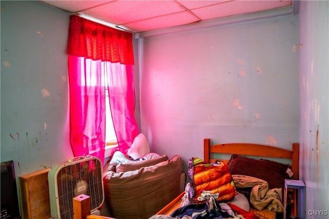 bedroom with a paneled ceiling