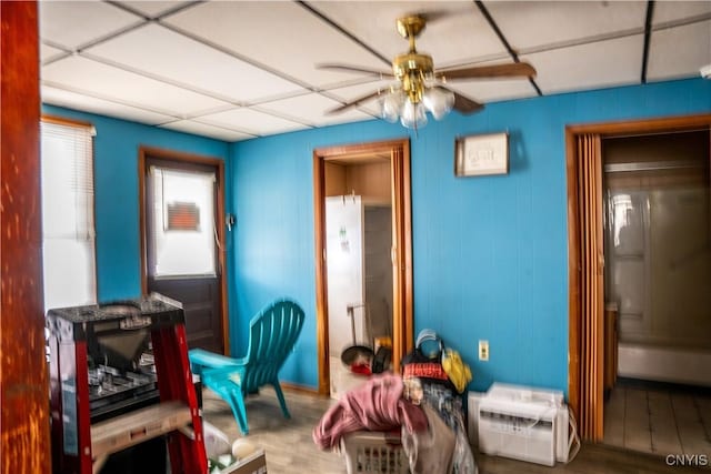 game room with a ceiling fan and wood finished floors