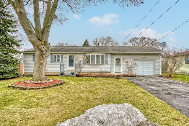 ranch-style home featuring a garage, a front lawn, aphalt driveway, and entry steps