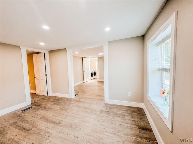 unfurnished room featuring baseboards, recessed lighting, visible vents, and light wood-style floors