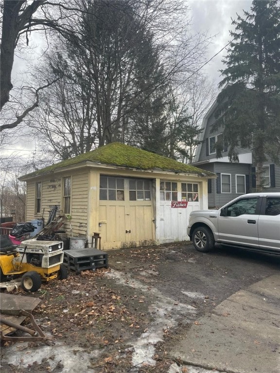 view of side of property featuring driveway