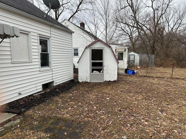 view of property exterior with a shed and an outdoor structure