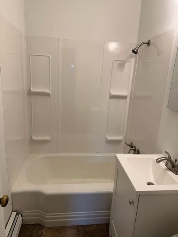 bathroom with shower / bathing tub combination, vanity, and baseboard heating