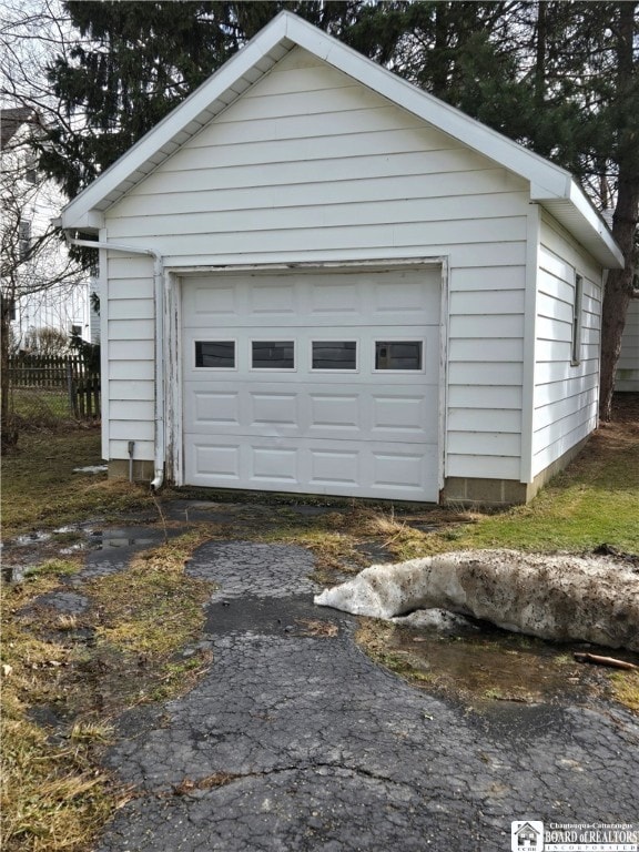 detached garage with fence