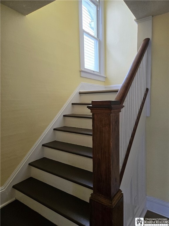 stairway with baseboards