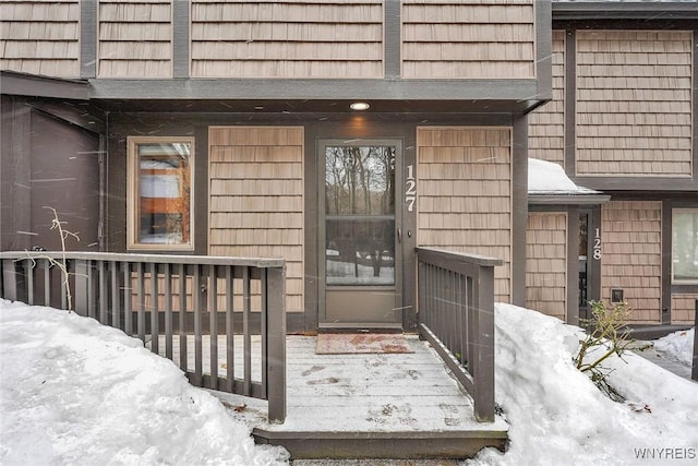 view of snow covered property entrance