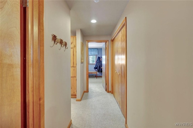 corridor featuring recessed lighting, carpet flooring, and baseboards