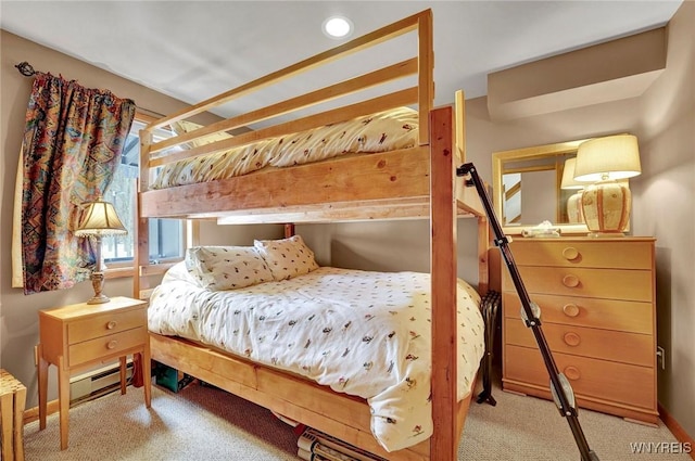 bedroom with a baseboard heating unit, carpet flooring, and recessed lighting