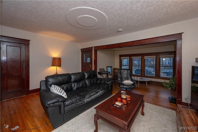 living area with wood finished floors and baseboards