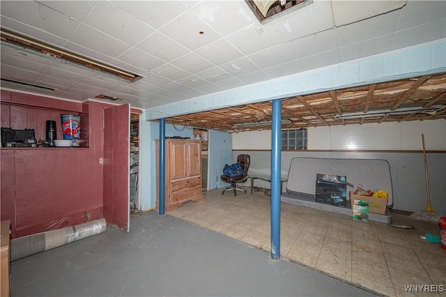 unfinished basement with tile patterned floors