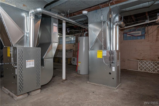 utility room with heating unit and water heater