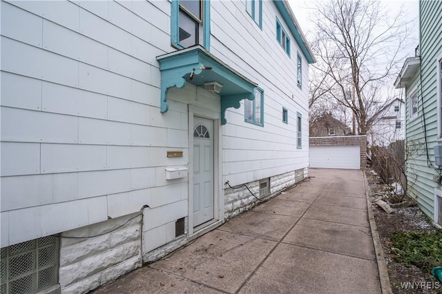 view of exterior entry featuring a garage