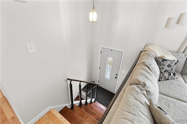 entrance foyer featuring baseboards and wood finished floors