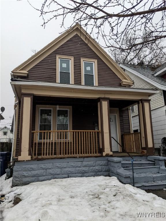 bungalow-style house featuring covered porch