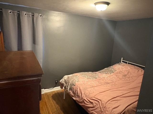 bedroom featuring wood finished floors