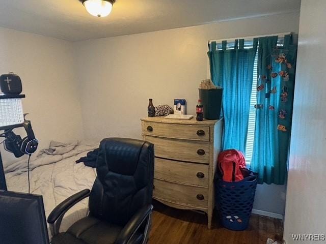 bedroom featuring dark wood-type flooring