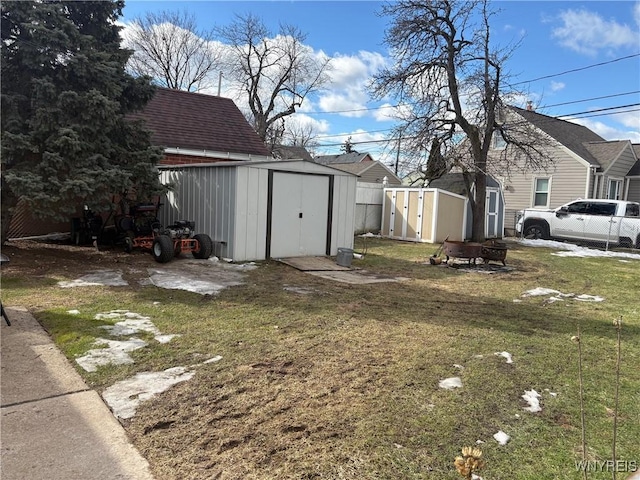 view of yard with an outbuilding and a storage unit