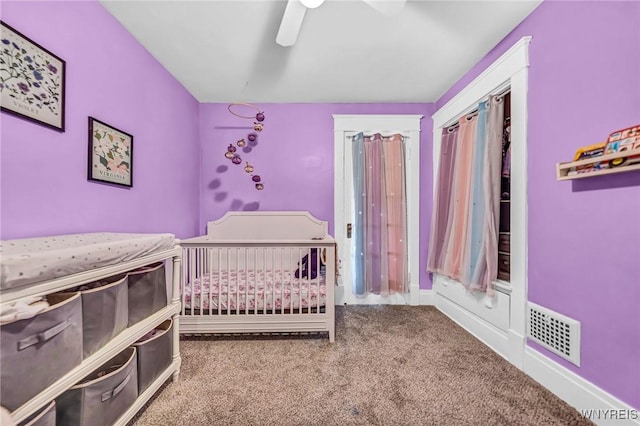 bedroom with carpet, visible vents, ceiling fan, and baseboards