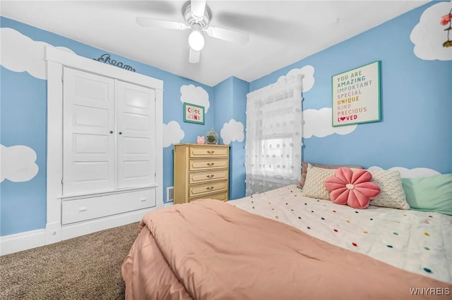 bedroom with carpet floors, a closet, a ceiling fan, and baseboards