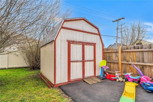 view of shed with a fenced backyard