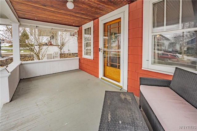 unfurnished sunroom featuring wood ceiling