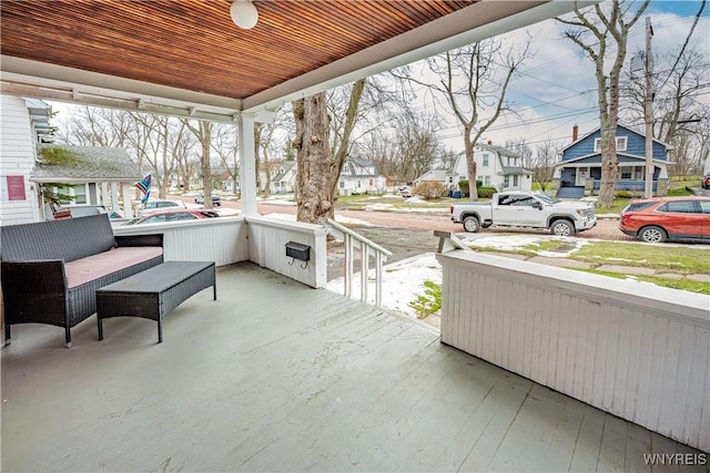 view of patio with a residential view and a porch