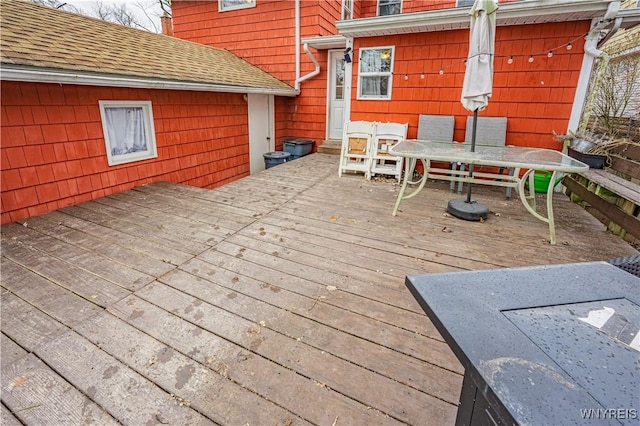 wooden deck featuring outdoor dining space