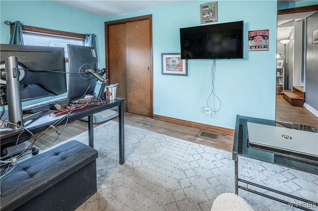 office area featuring wood finished floors and baseboards