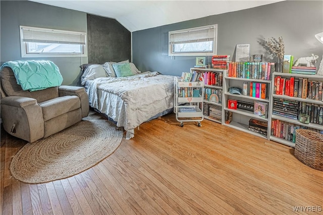 bedroom featuring lofted ceiling and wood-type flooring