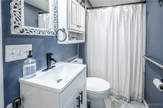 full bathroom with marble finish floor, vanity, toilet, and a shower with curtain